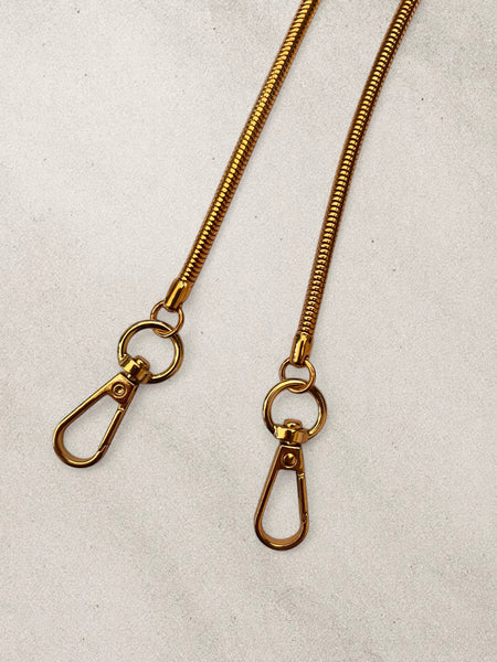 Cadena Metal Escamas Dorada 110 cms.